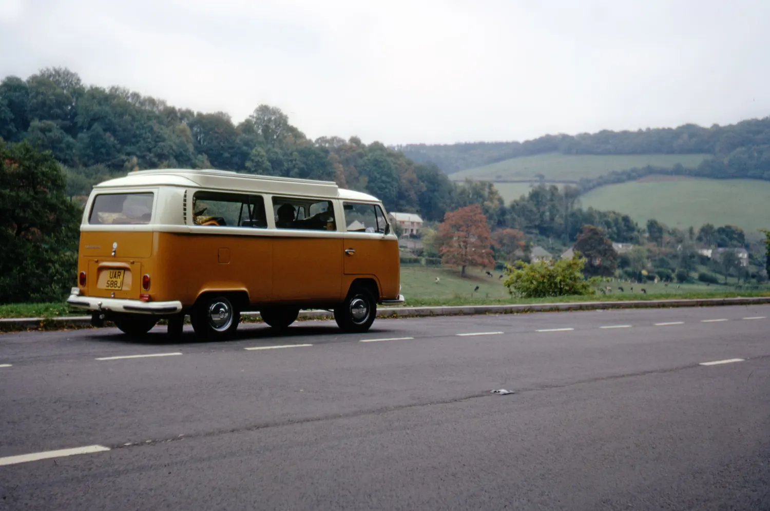 A camper van on a road through the British countryside